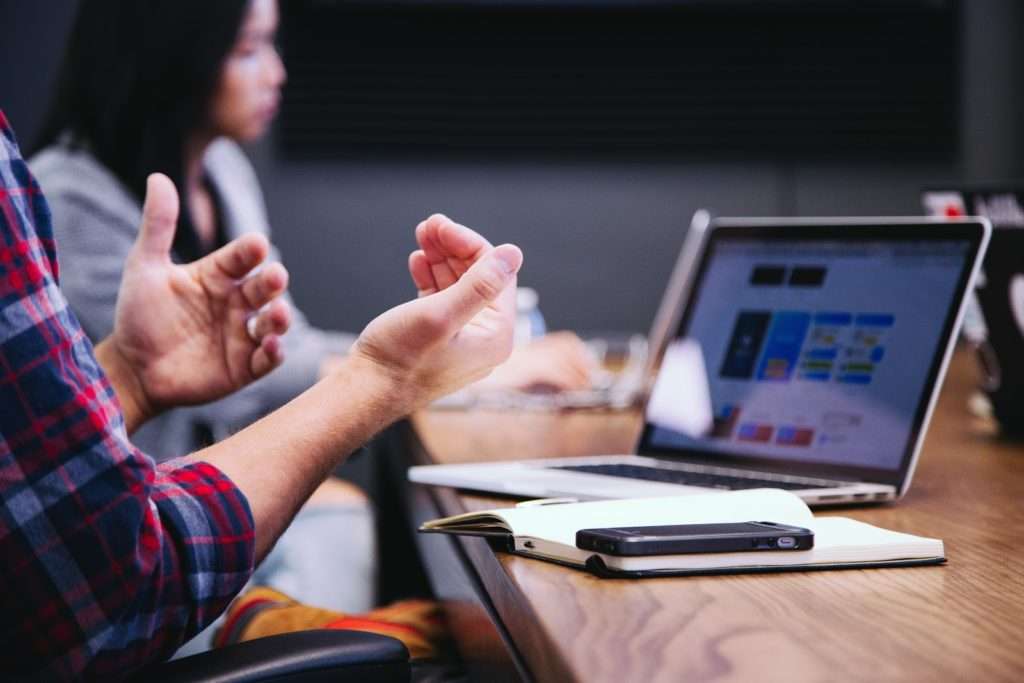 view of a desk during a team meeting